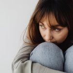 A woman curled up (Photo: Karolina Grabowska)