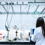 A scientist working in a lab with her back to the camera (Photo: ThisIsEngineering)